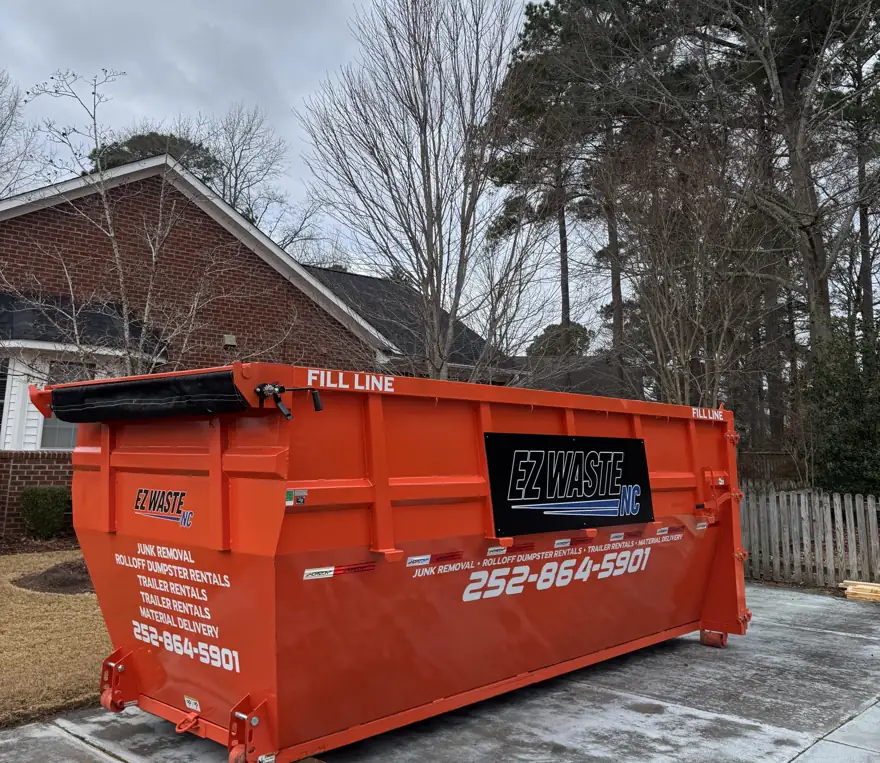 Clean EZ Waste roll-off dumpster on a concrete pad